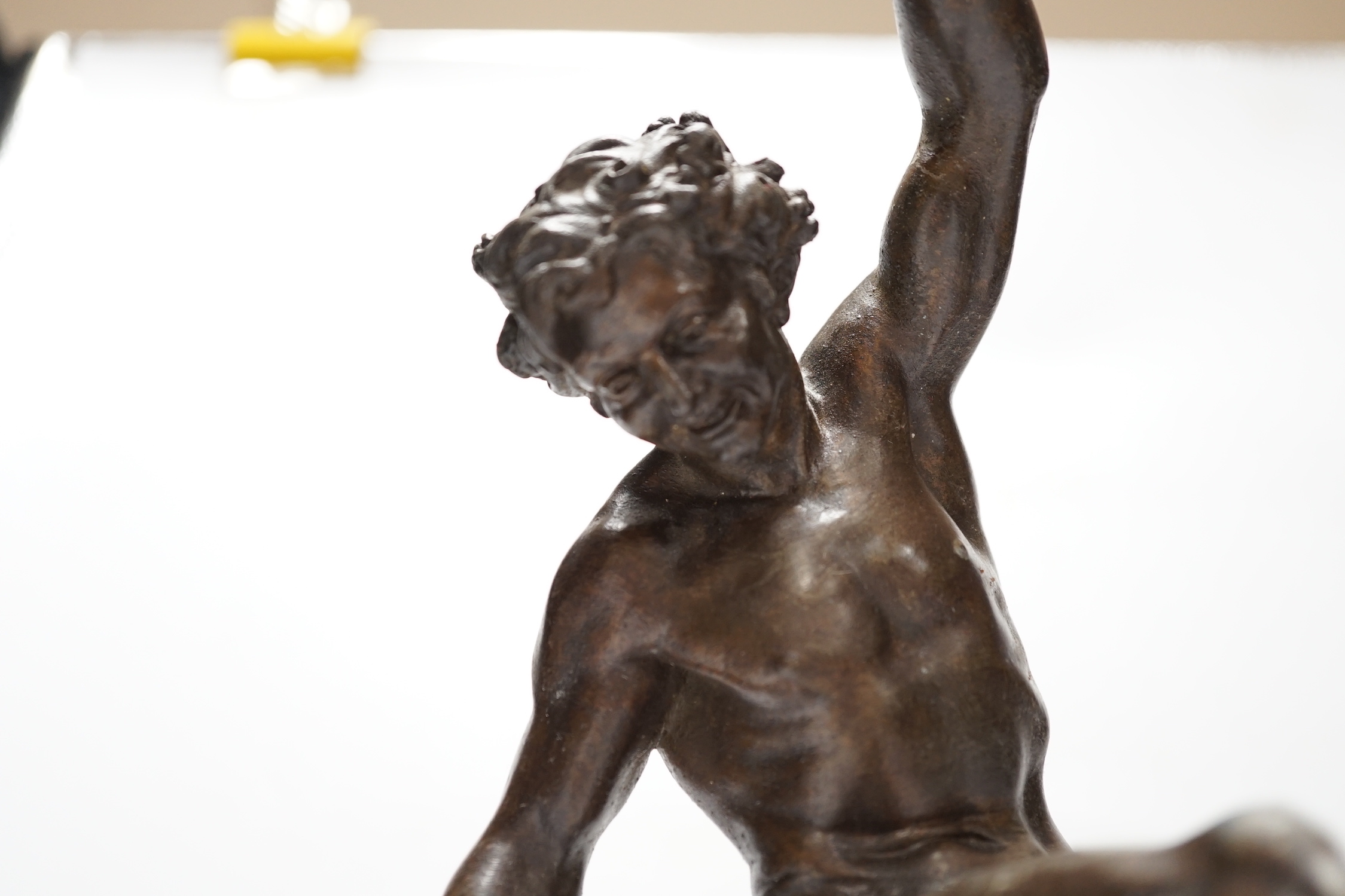 A bronzed spelter dancing figure of Bacchus - ‘Le Vin’, with a fawn and bunches of grapes, on a marble base, 36cm high